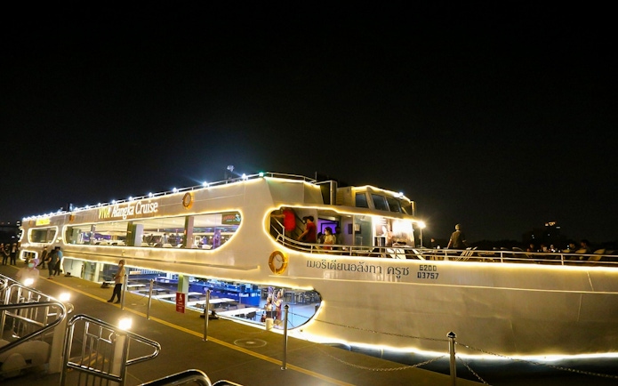Viva Alangka Cruise docked on Chao Phraya River at night, Bangkok.