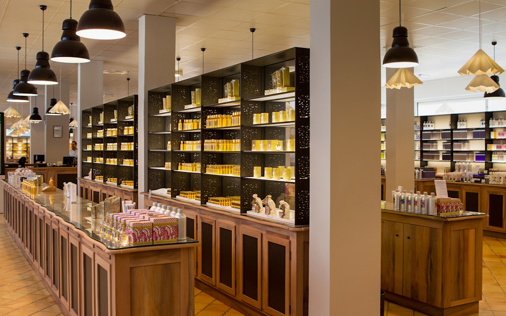Perfume workshop interior with shelves of fragrance bottles in Eze-Village near Nice and Monaco.