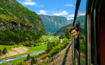 Guests enjoying scenic views from Flåm Railway in Bergen, Norway.