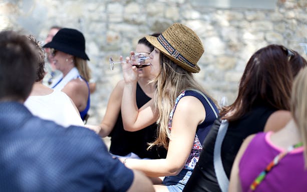 Group enjoying wine tasting during Chianti tour.