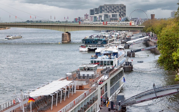 Cologne Harbour with cruise ships docked along the Rhine River.