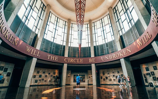 Country Music Hall of Fame interior, Nashville, with visitors exploring exhibits.