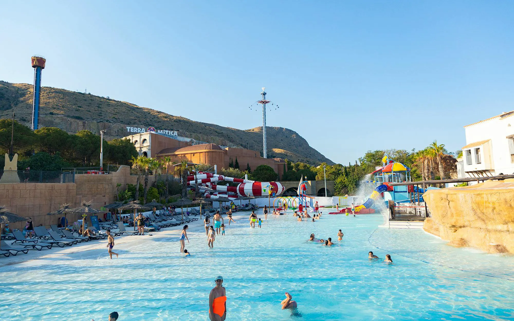 Visitors enjoying the water park at Terra Mitica theme park in Spain.