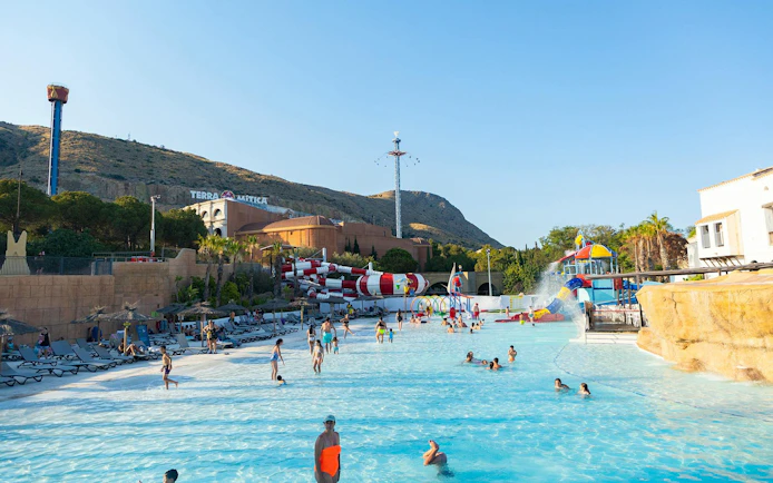 Visitors enjoying the water park at Terra Mitica theme park in Spain.