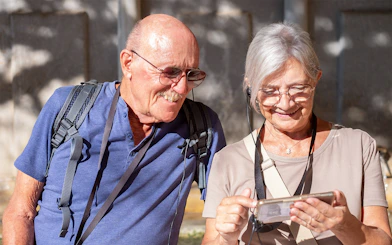 Tourists using audio guide in Paris's Latin Quarter with OPA SI Pass.