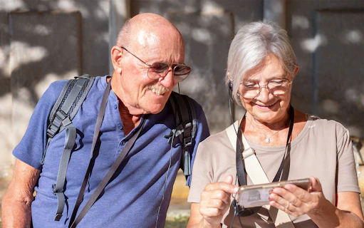 Tourists using audio guide in Paris's Latin Quarter with OPA SI Pass.