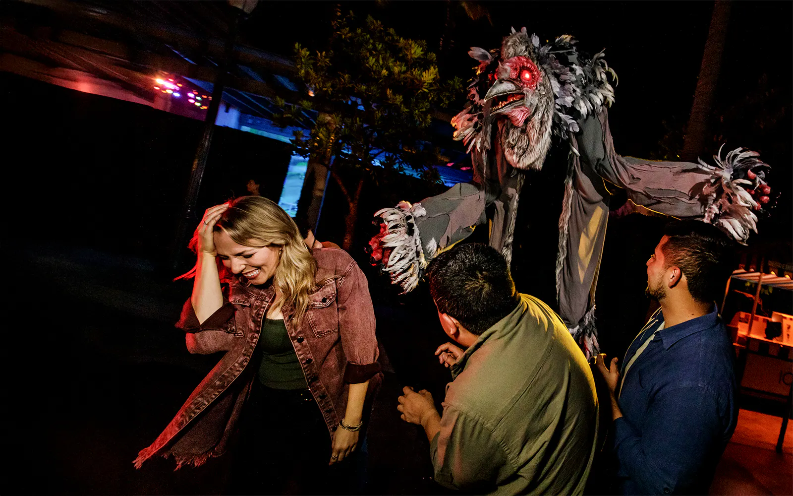 Guests reacting to a creature at Hollywood Horror Nights, Universal Studios Hollywood, Los Angeles.