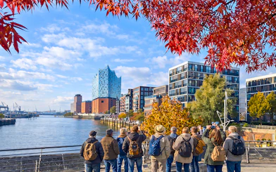 Group of tourists viewing Elbphilharmonie and HafenCity in Hamburg, Germany.