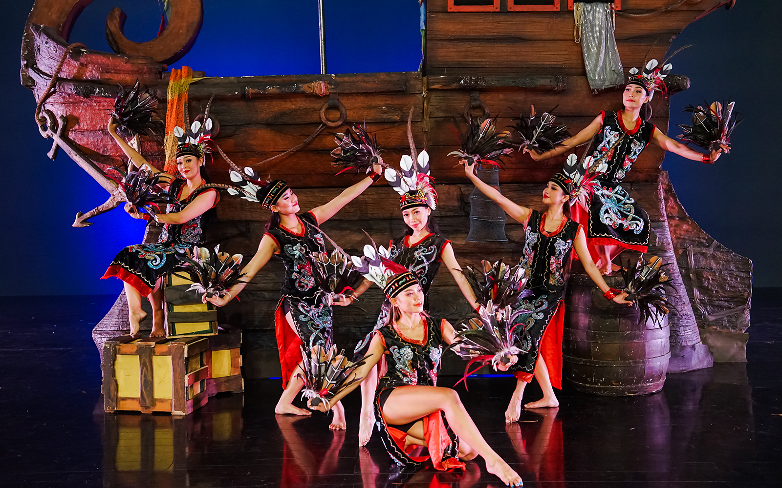 Performers at Devdan Show in Bali, displaying traditional Indonesian dance in vibrant costumes.