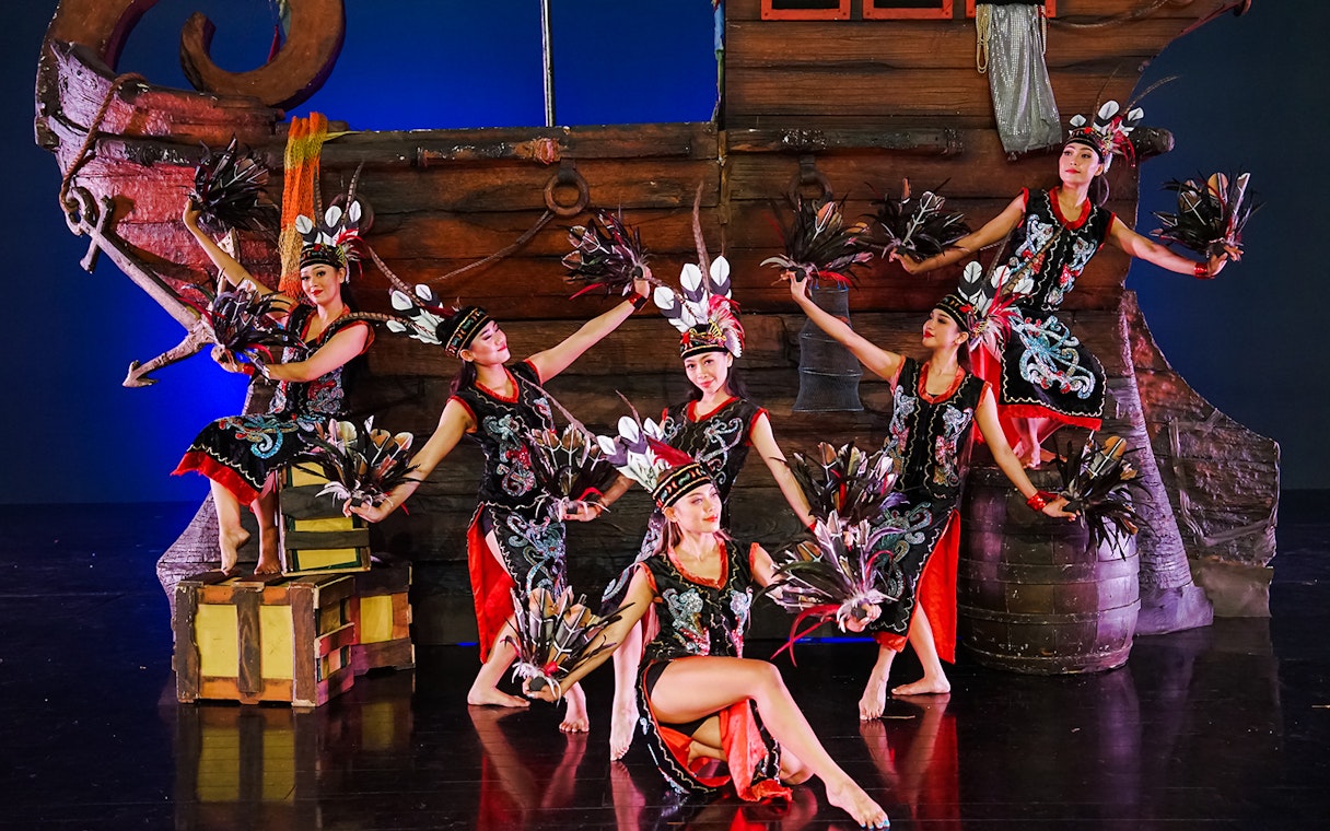 Performers at Devdan Show in Bali, displaying traditional Indonesian dance in vibrant costumes.