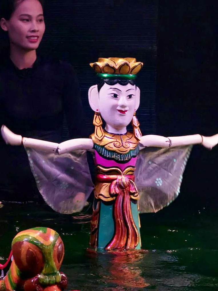 Performers with puppets at Thang Long Water Puppet Show in Hanoi, Vietnam.