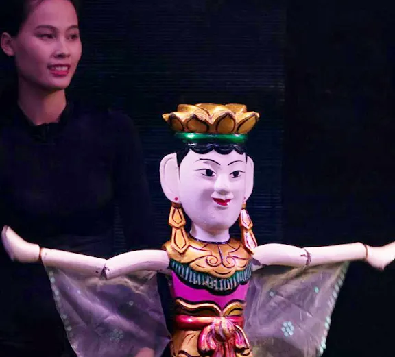 Performers with puppets at Thang Long Water Puppet Show in Hanoi, Vietnam.