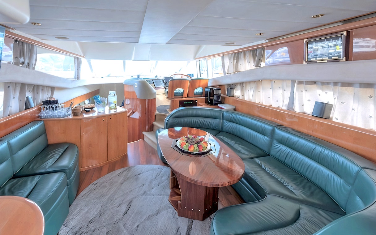 Interior of a Whale Watching boat in Skjervøy with seating and refreshments.