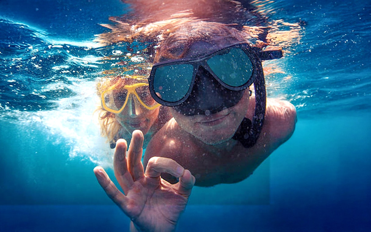 Guests snorkeling in clear waters during Bol, Hvar, Pakleni islands & Šolta tour.