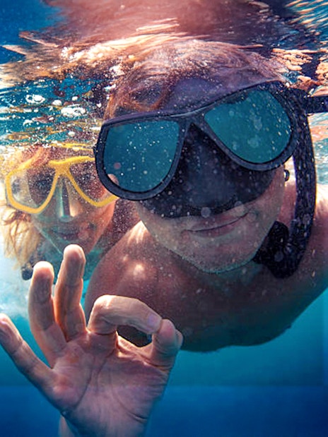 Guests snorkeling in clear waters during Bol, Hvar, Pakleni islands & Šolta tour.