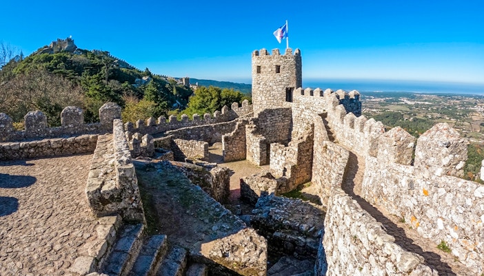 Moorish Castle stone walls and tower overlooking Sintra landscape.