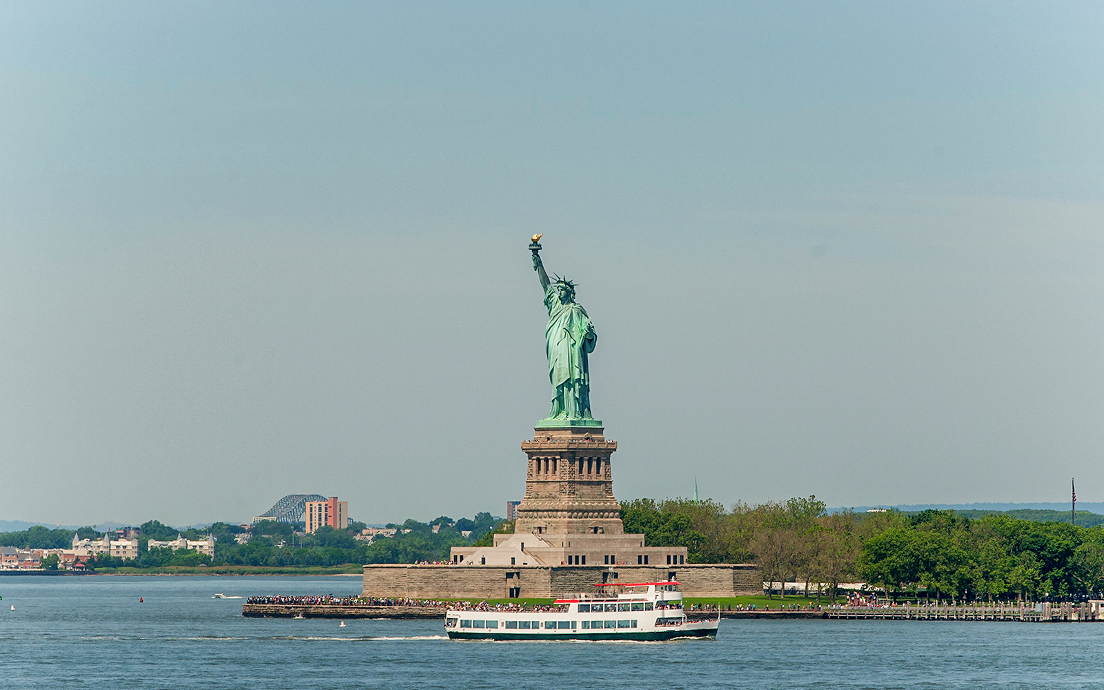 Ellis Island ferry passing by the Statue of Liberty
