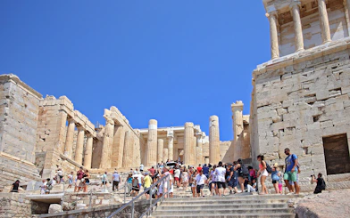 Visitors at Propylaia entrance, Athens Acropolis, Greece.
