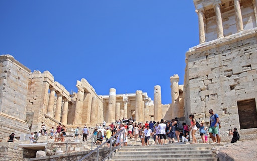 Visitors at Propylaia entrance, Athens Acropolis, Greece.