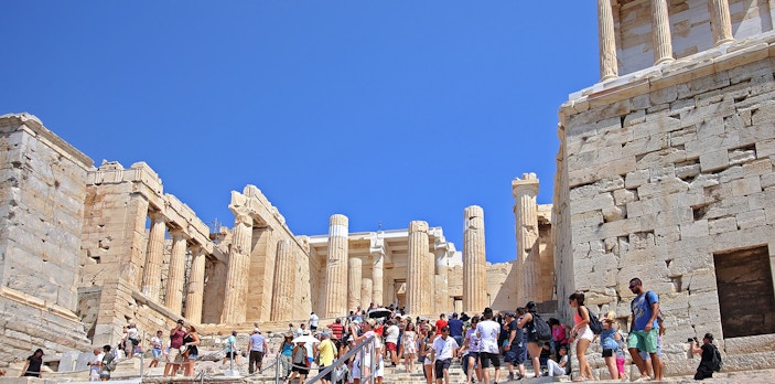 Visitors at Propylaia entrance, Athens Acropolis, Greece.