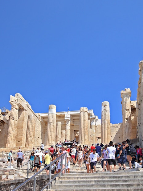 Visitors at Propylaia entrance, Athens Acropolis, Greece.