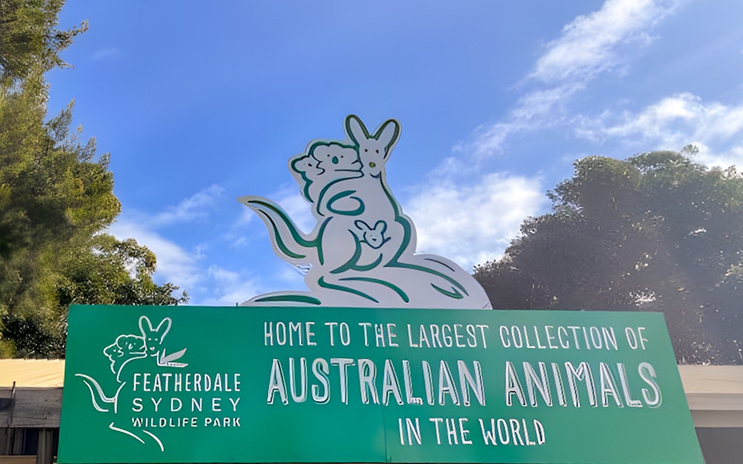 Featherdale Wildlife Park entrance sign with kangaroo illustration, Sydney.