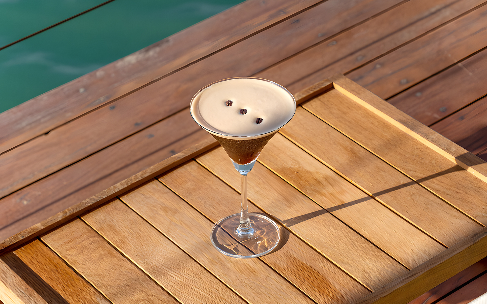 Cocktail on wooden table at Yona Beach Club, Phuket.