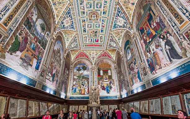 Frescoes and ornate ceiling in Piccolomini Library, Siena Cathedral, Italy.