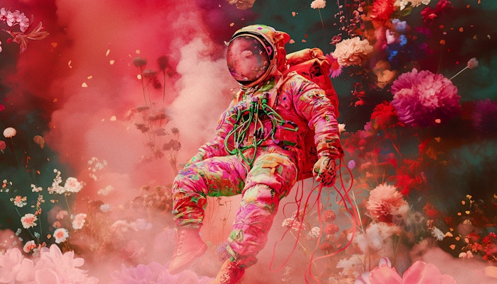 Astronaut in colorful suit floating among vibrant flowers, symbolizing "Another World Is Possible.