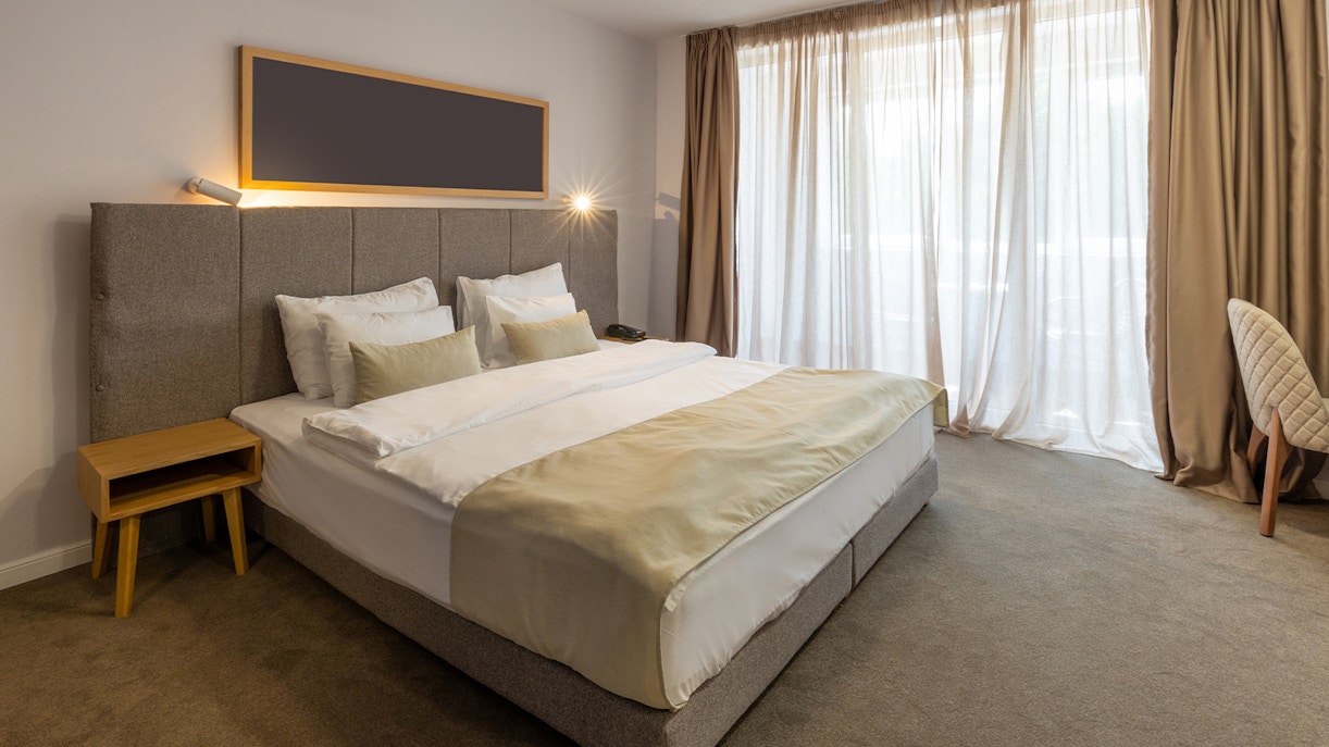 Interior of a luxury hotel double bed bedroom