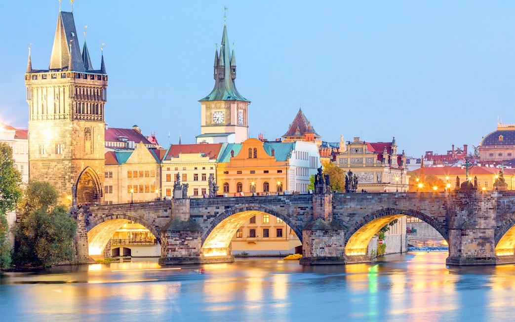 Charles Bridge over Vltava River at dusk, Prague.