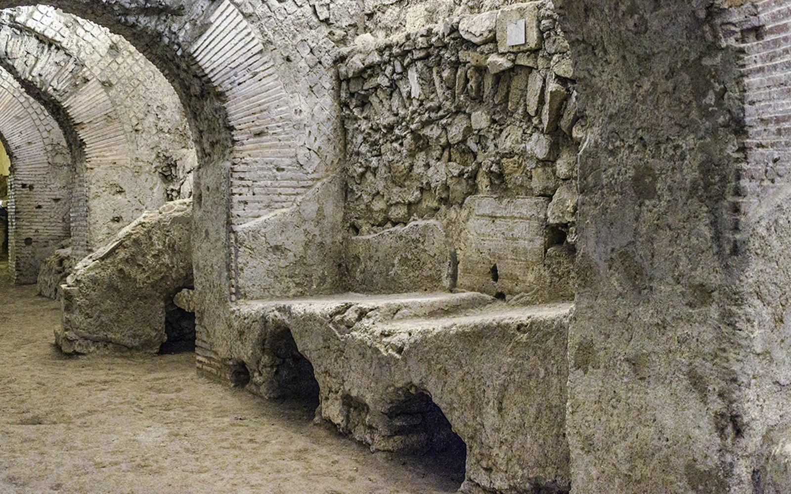 Neapolis Sotterrata underground ruins with ancient stone arches in Naples, Italy.