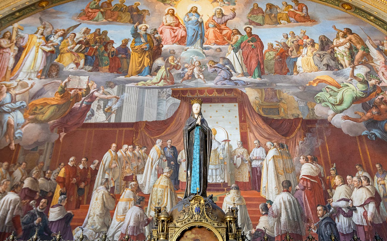 Tourists viewing frescoes in the Vatican Museums, Rome, with exclusive Patrizi Palace ticket access.