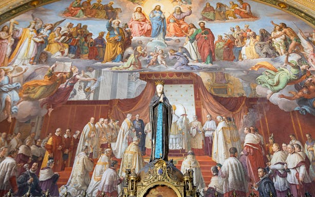 Tourists viewing frescoes in the Vatican Museums, Rome, with exclusive Patrizi Palace ticket access.
