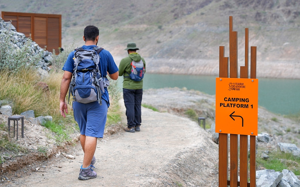 Hikers walking towards Camping Platform 1 at Fujairah Adventure Park.