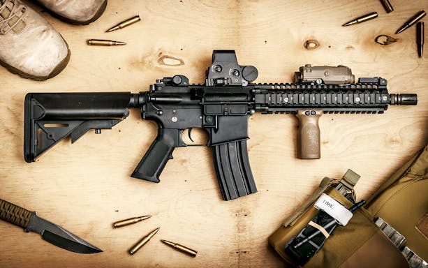 Rifle and gear at extreme shooting range with hotel transfer.