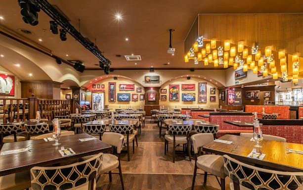 Dining area at Hard Rock Cafe München with tables set for lunch or dinner.