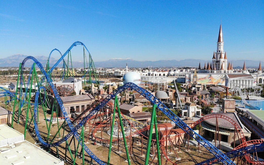 Roller coasters and castle at The Land of Legends Theme Park, Turkey.