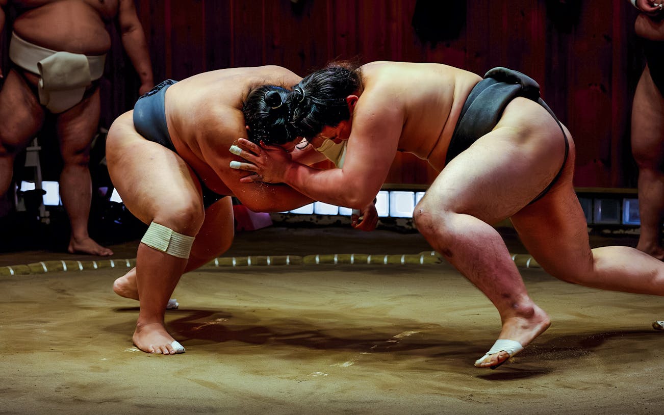 Sumo wrestlers practicing at a Tokyo stable during morning tour.