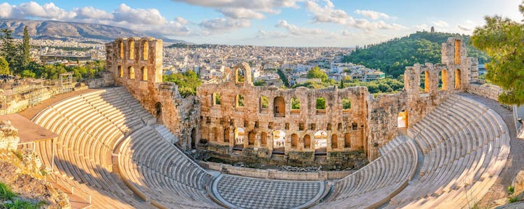 Odeon of Herodes Atticus amphitheater in Athens, Greece, with ancient stone seating and stage.