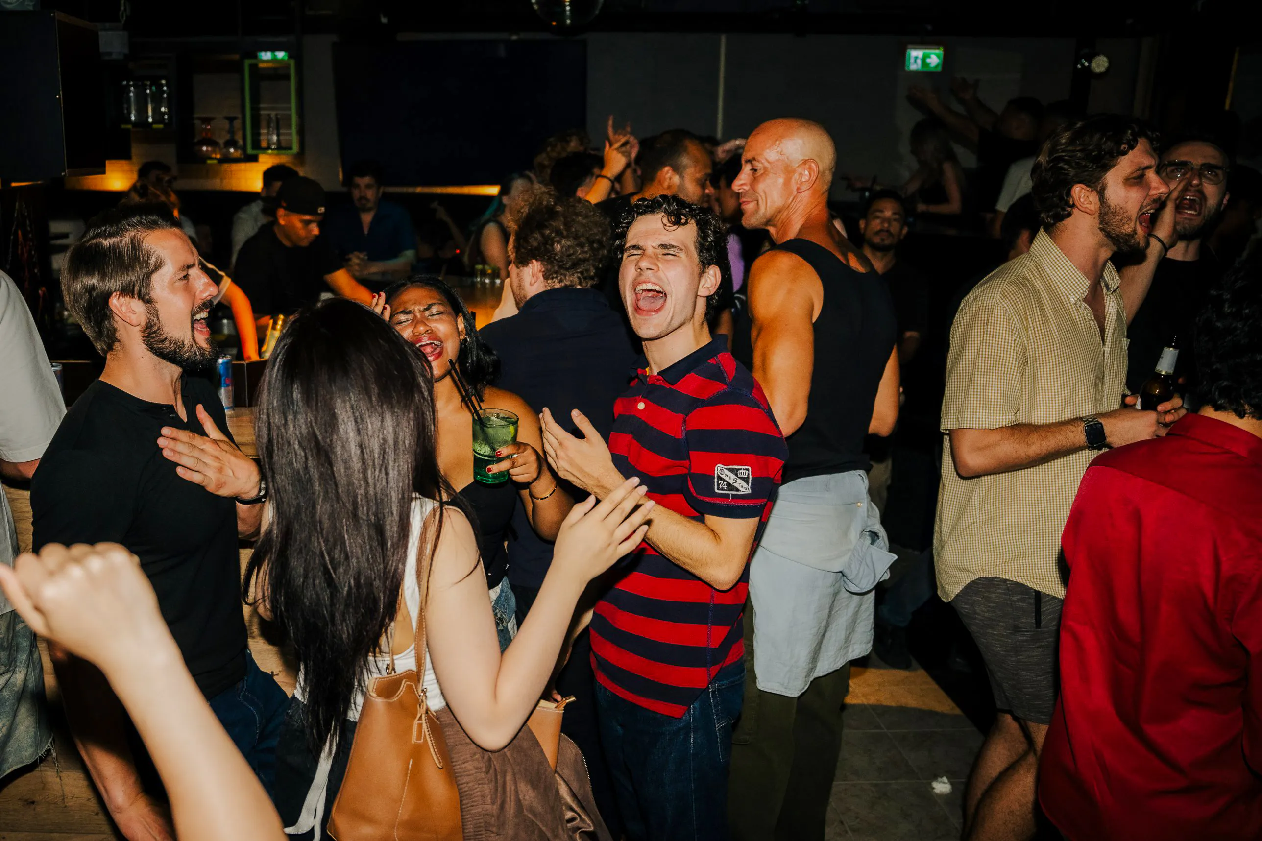 Group enjoying nightlife at a bar during Frankfurt Nightlife Tour, Frankfurt am Main.