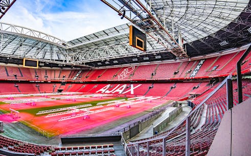 Visitors exploring the iconic Johan Cruijff ArenA during the Classic Tour in Amsterdam