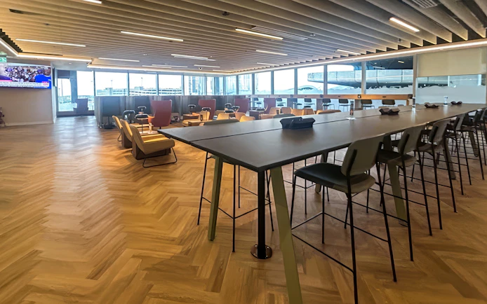 Phoenix Lounge seating area with tables and chairs at Dublin Airport Terminal 1.
