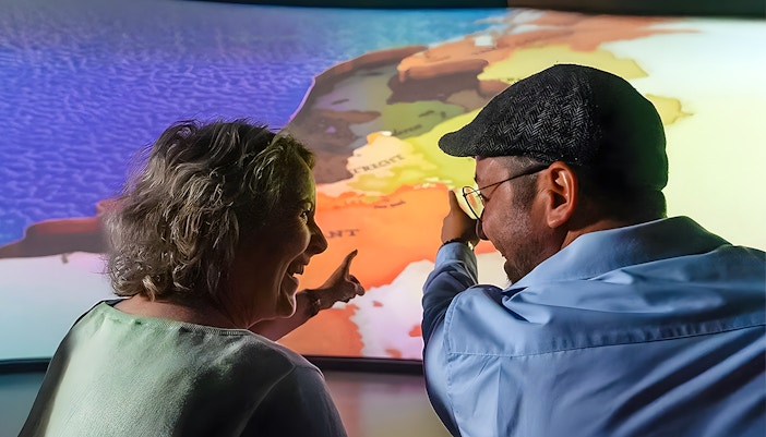 Tourists experiencing 5D ride at This Is Holland Ultimate Flight Experience in Amsterdam.