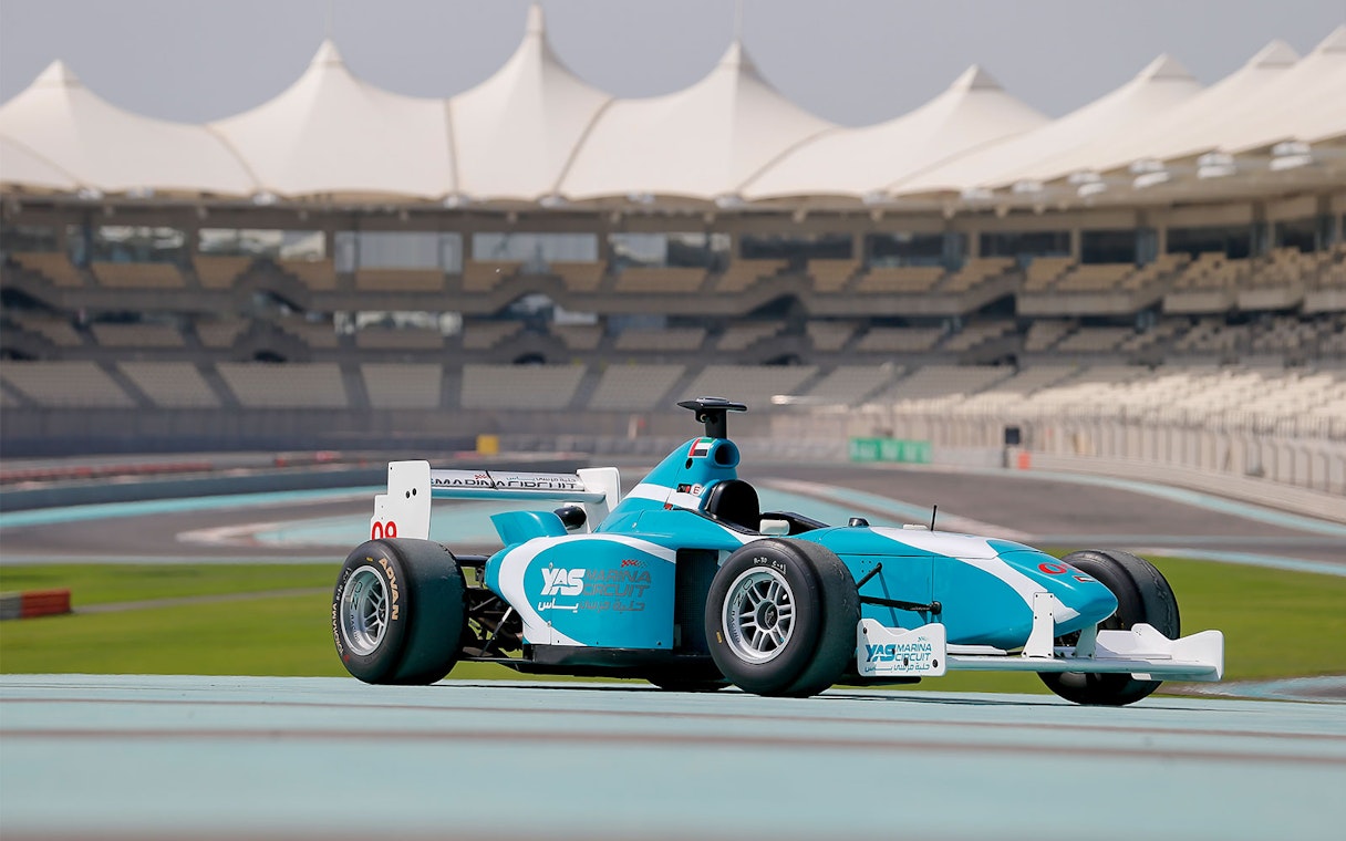 Race car on Yas Marina Circuit track during FORMULA YAS 3000 Driving Experience in Abu Dhabi.