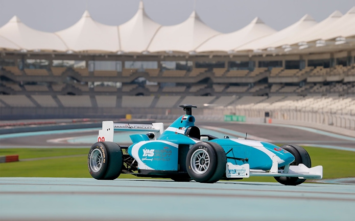 Race car on Yas Marina Circuit track during FORMULA YAS 3000 Driving Experience in Abu Dhabi.