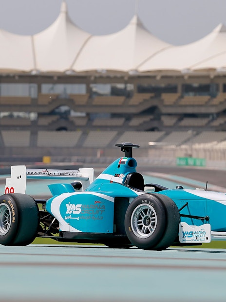 Race car on Yas Marina Circuit track during FORMULA YAS 3000 Driving Experience in Abu Dhabi.