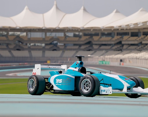 Race car on Yas Marina Circuit track during FORMULA YAS 3000 Driving Experience in Abu Dhabi.