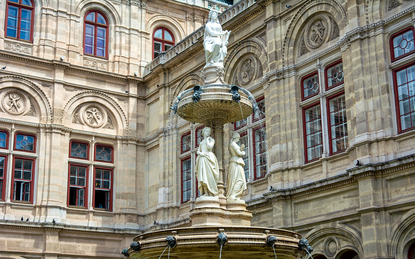 Statues on a fountain at the Vienna Opera House, Austria.