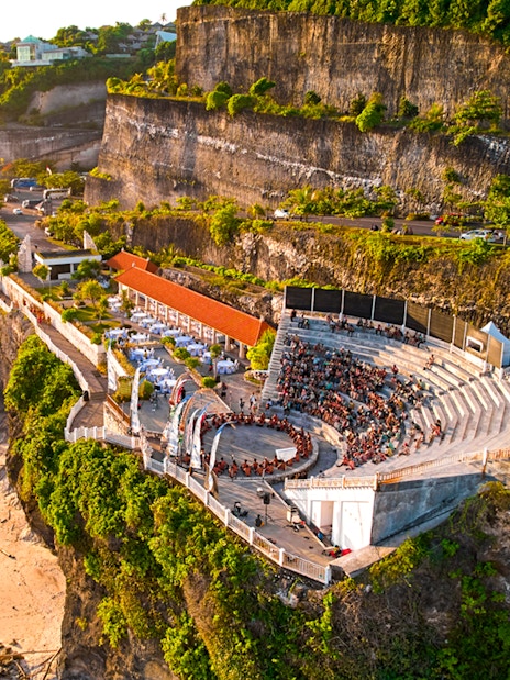 Kecak and Fire Dance Show amphitheater at Melasti Beach, Bali, with ocean view.